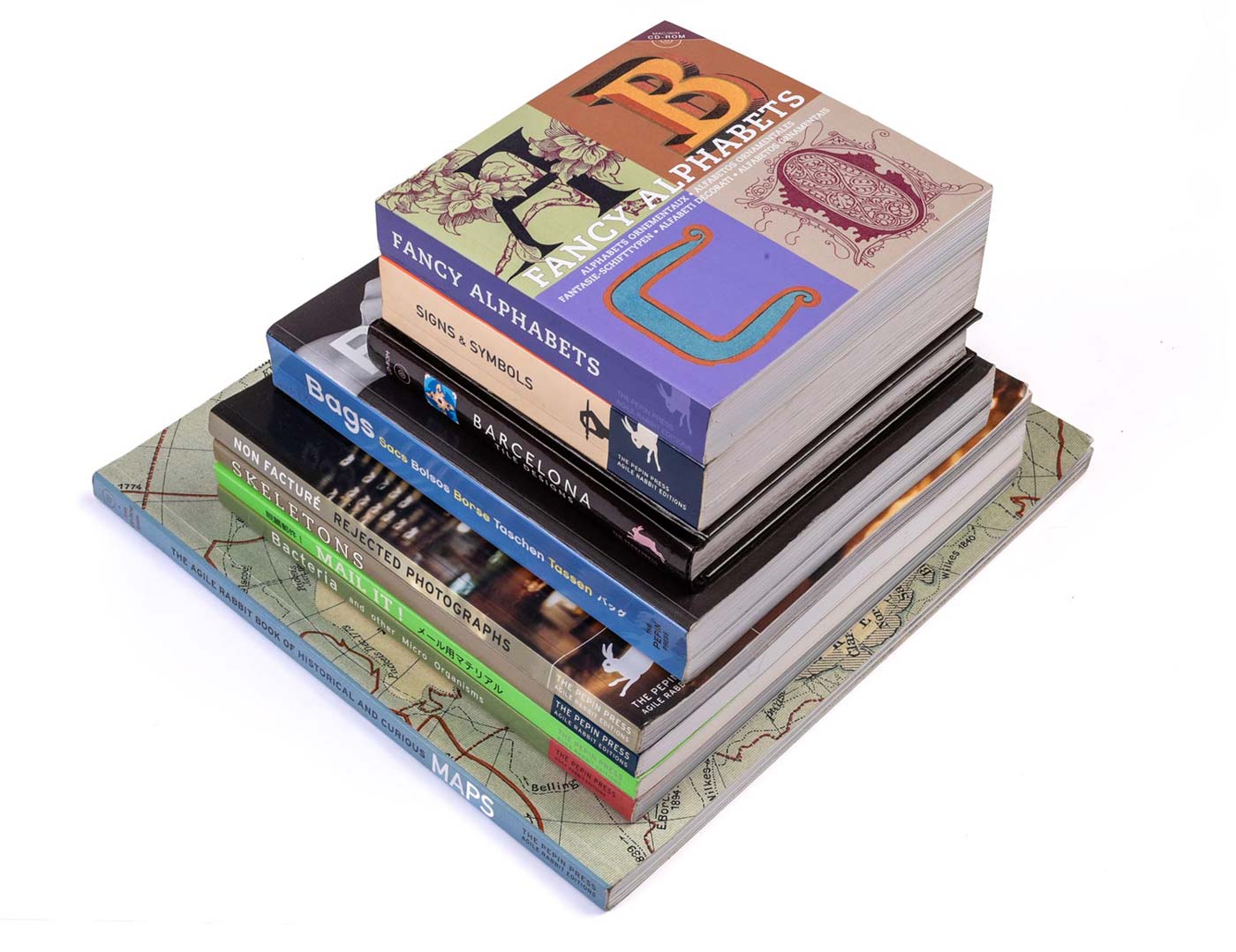 stapeltje boeken van de Pepin Press, met Fancy Alphabets, Bags, Signs & Symbols, Maps, Packaging Designs, Non Facturé en Bacteria's.